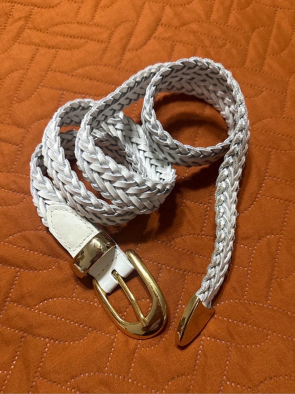 White braided leather belt with a gold-tone buckle and tip. Size US M/L